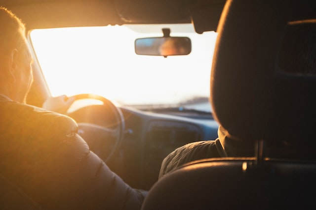 people traveling by car