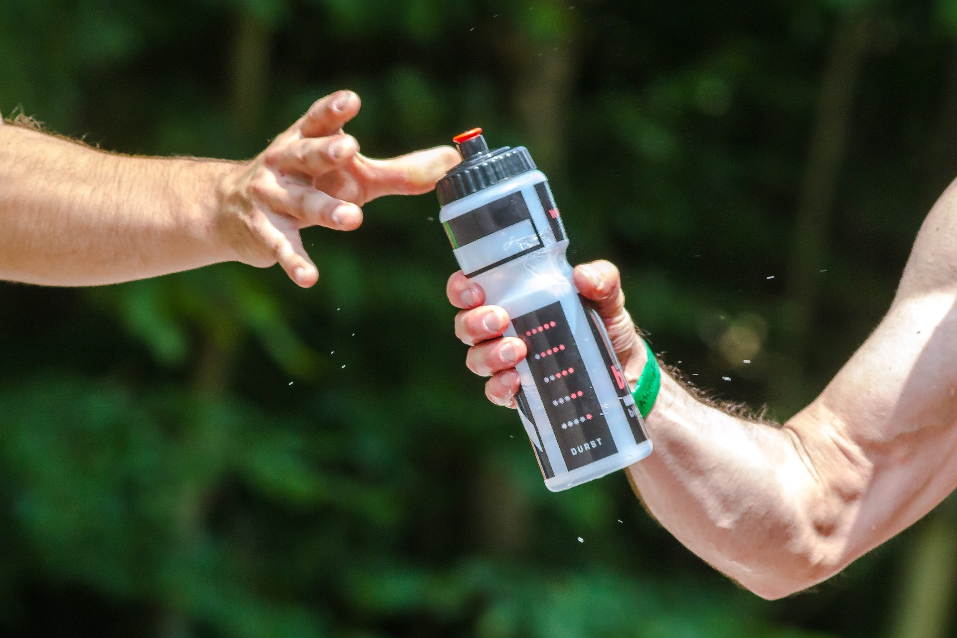 person taking a water bottle