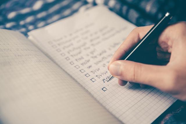 decluttering checklist in a notebook