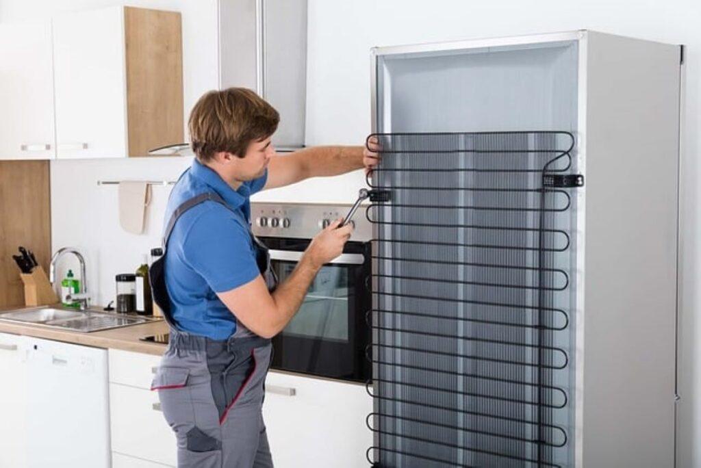 A man is using tools to show how to prepare your refrigerator and other appliances for your move